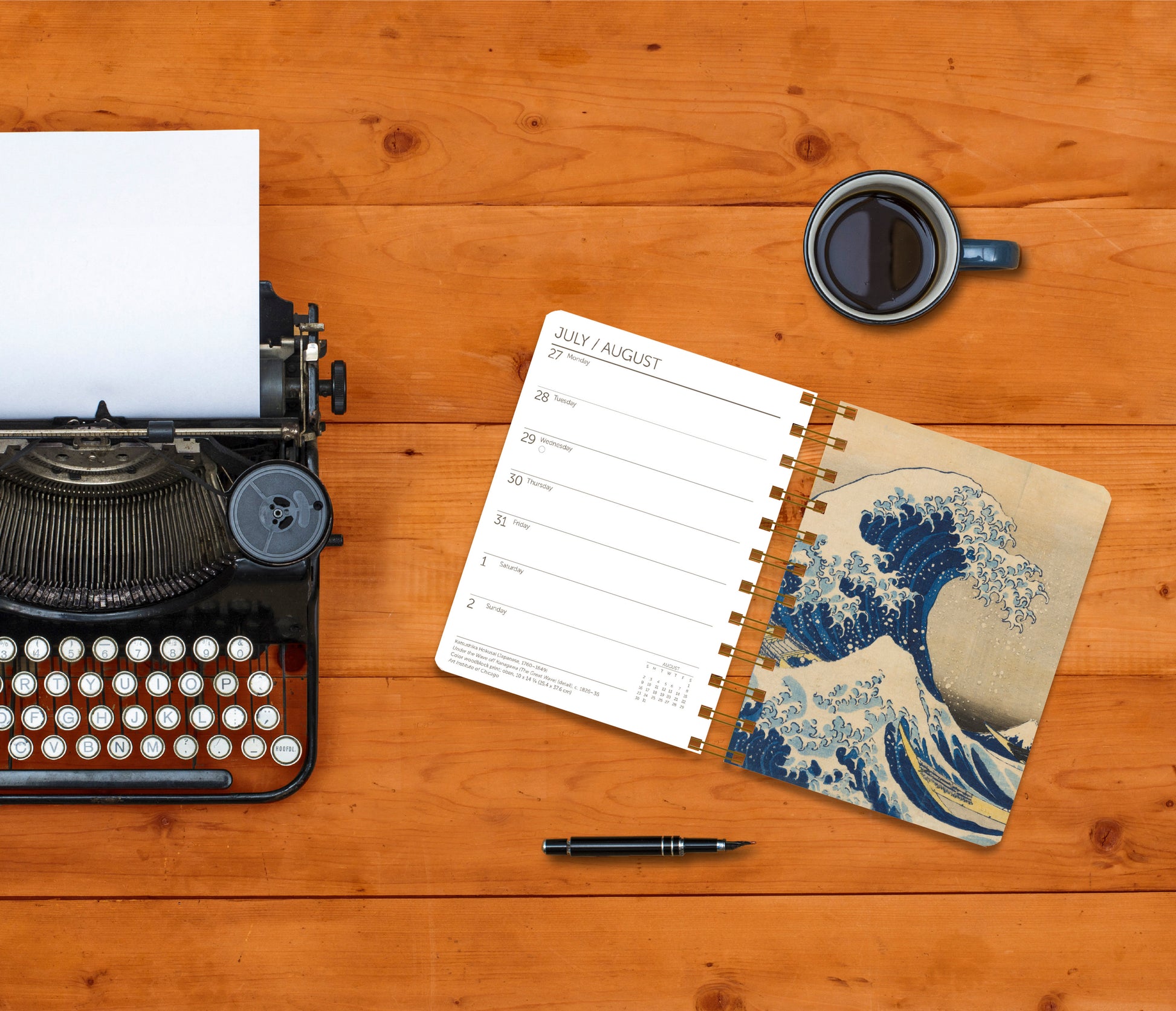 Stylish planner with weekly layout and timeless art iconography